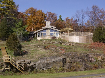 Renovated cottage with new wrap around deck with pool. Built on a cliff over looking the St. Lawrence river.