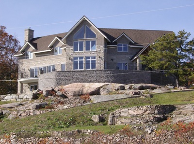 Custom built stone home built on a cliff over looking the St. Lawrence river. 
