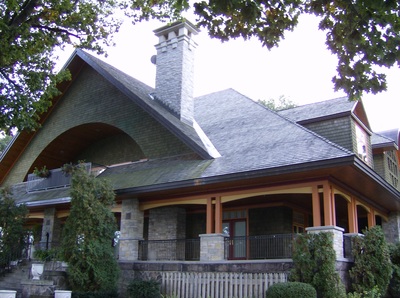 Custom Cottage highlighting the wrap around main floor porch and an upper floor porch.