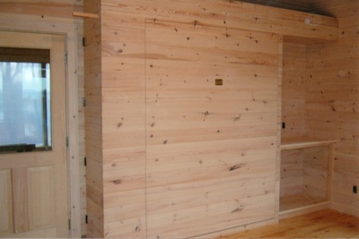 Custom murphy bed built in a bunk house in the closed position